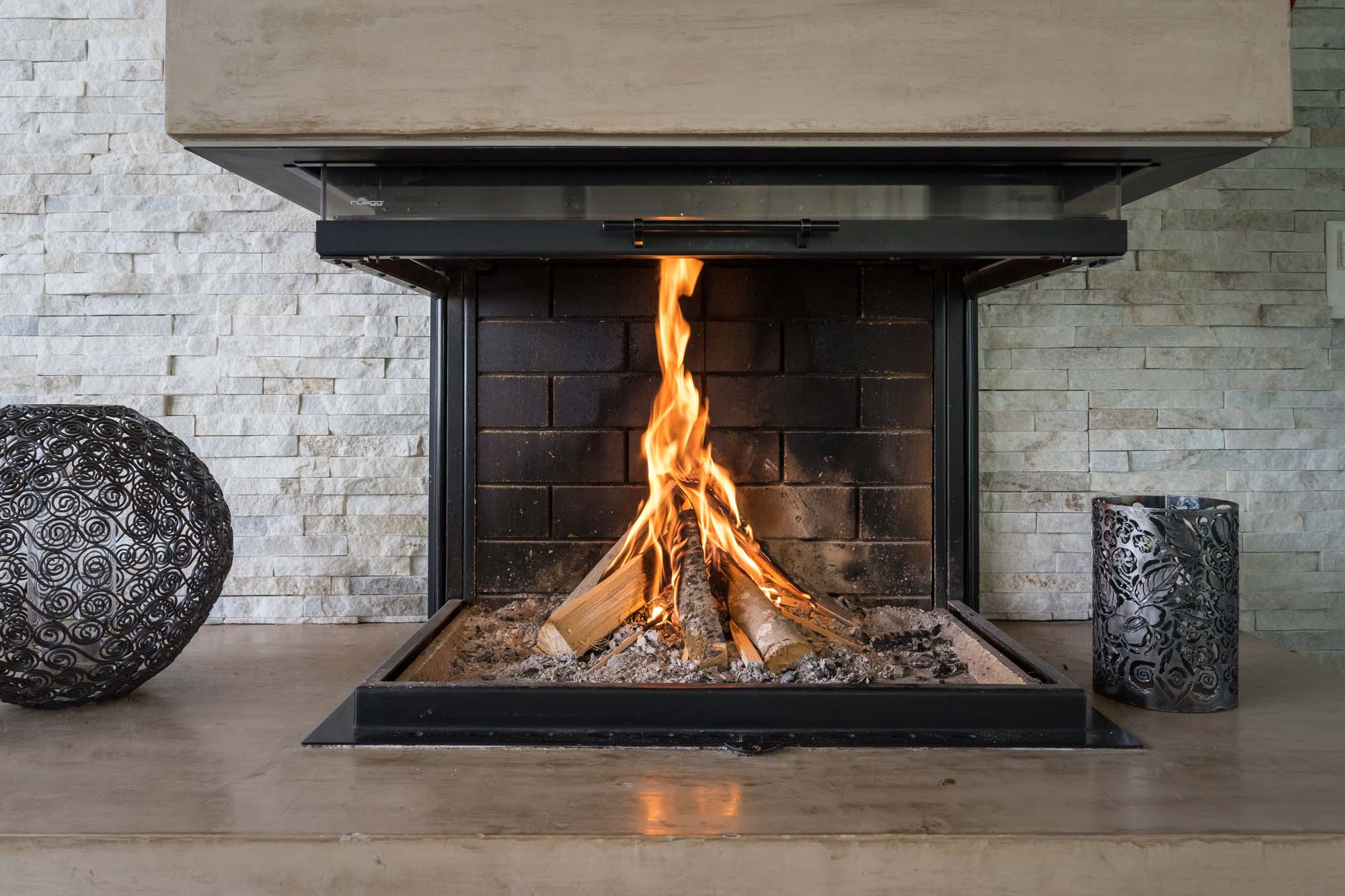 Luxury Fireplace. Fireplace in a modern luxury home with burning fire.